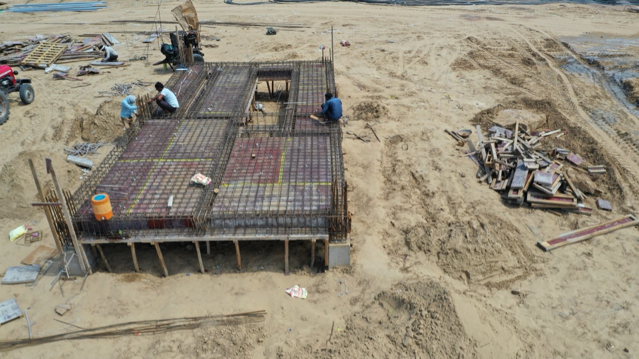 Workers on the reinforced roof deck of the control room building during construction