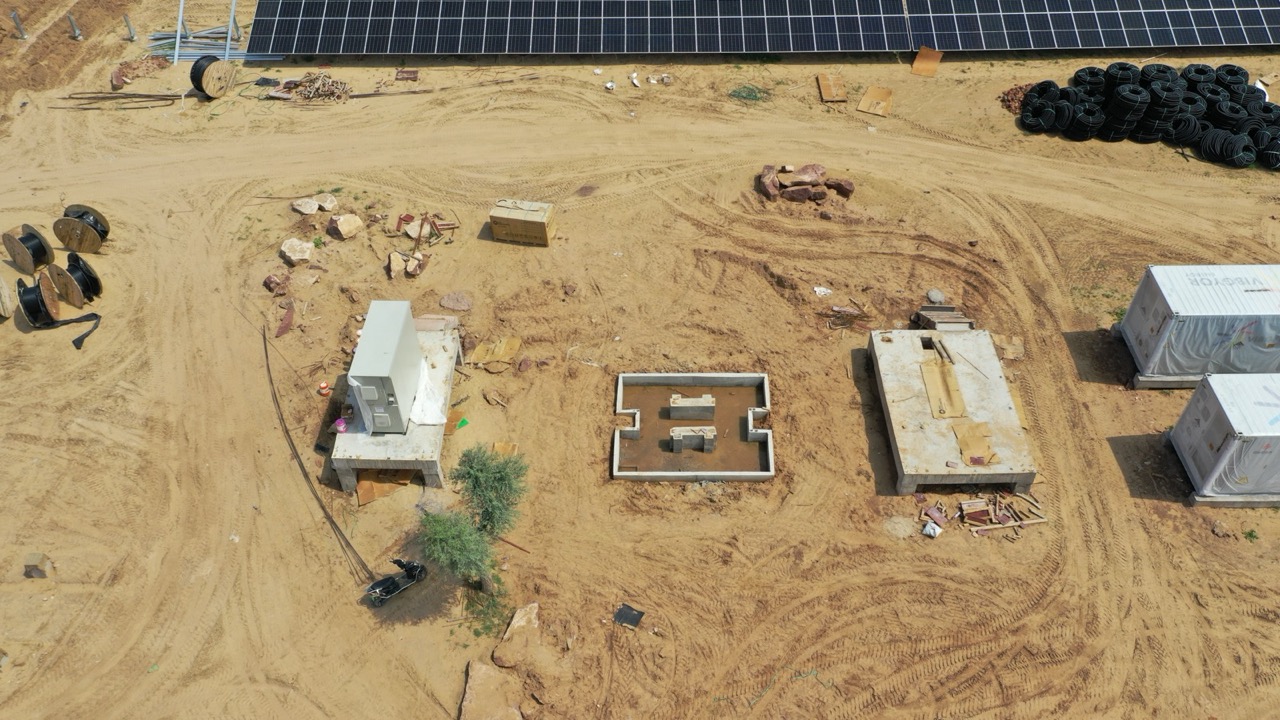 Aerial view of the electrical yard under construction, showing equipment plinths, foundations and delivered enclosures