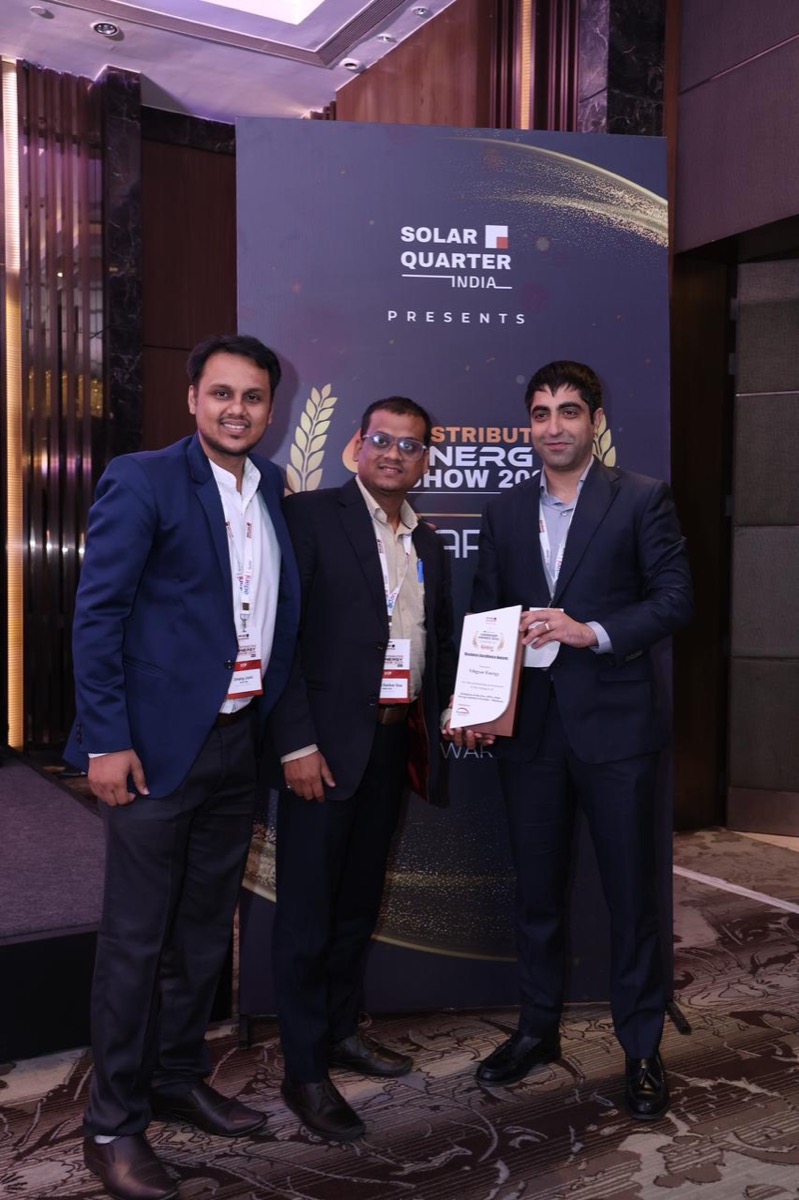 Three members of the Vibgyor Energy team in business dress at the Solar Quarter
                  Distributed Energy Show, holding the company's Business Excellence Award